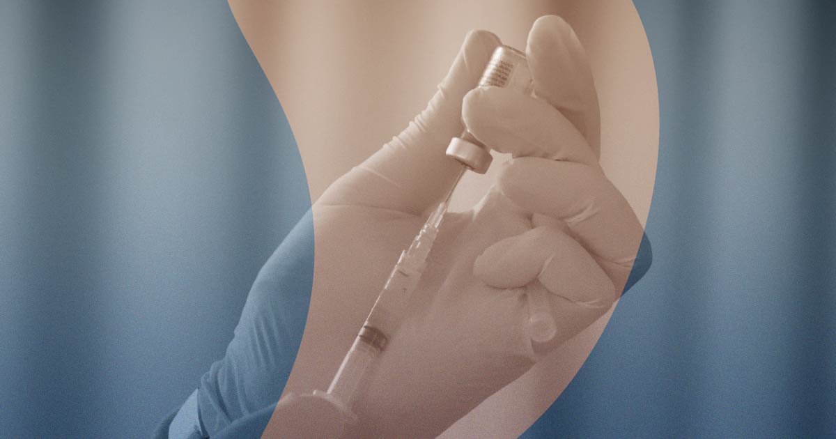 Person drawing vaccine contents